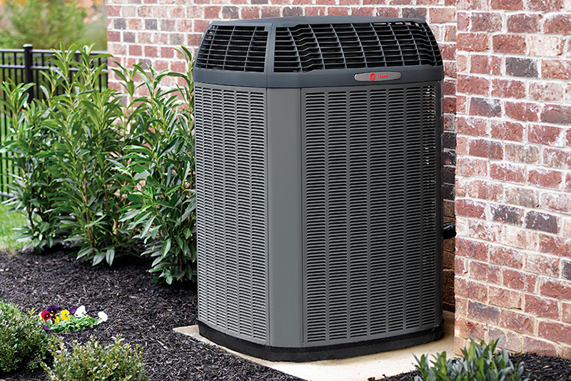 air conditioner installed outside of a home.